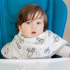 Toddler wearing the bunny bib sitting in a high chair